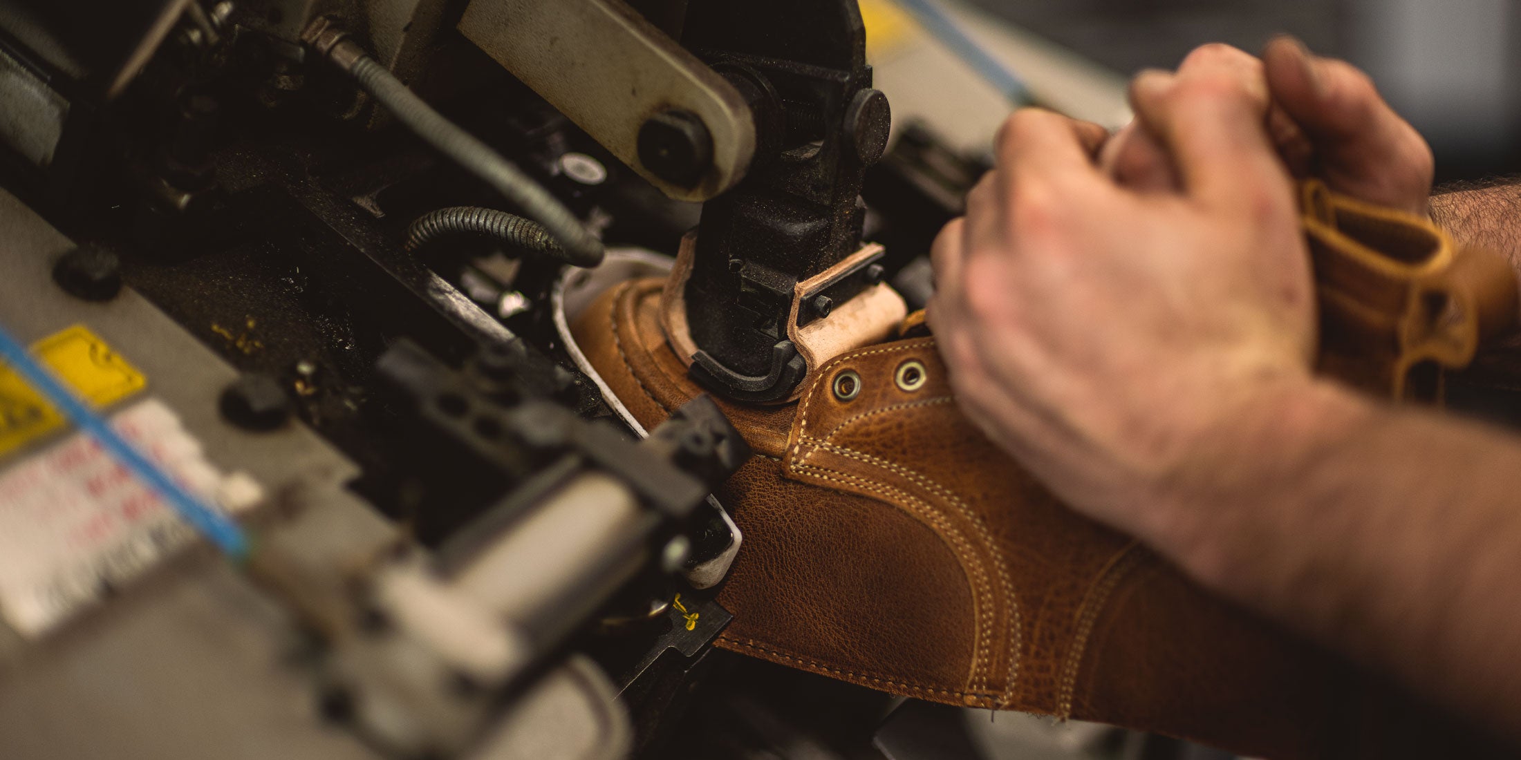 hands lasting a british tan grizzly boot