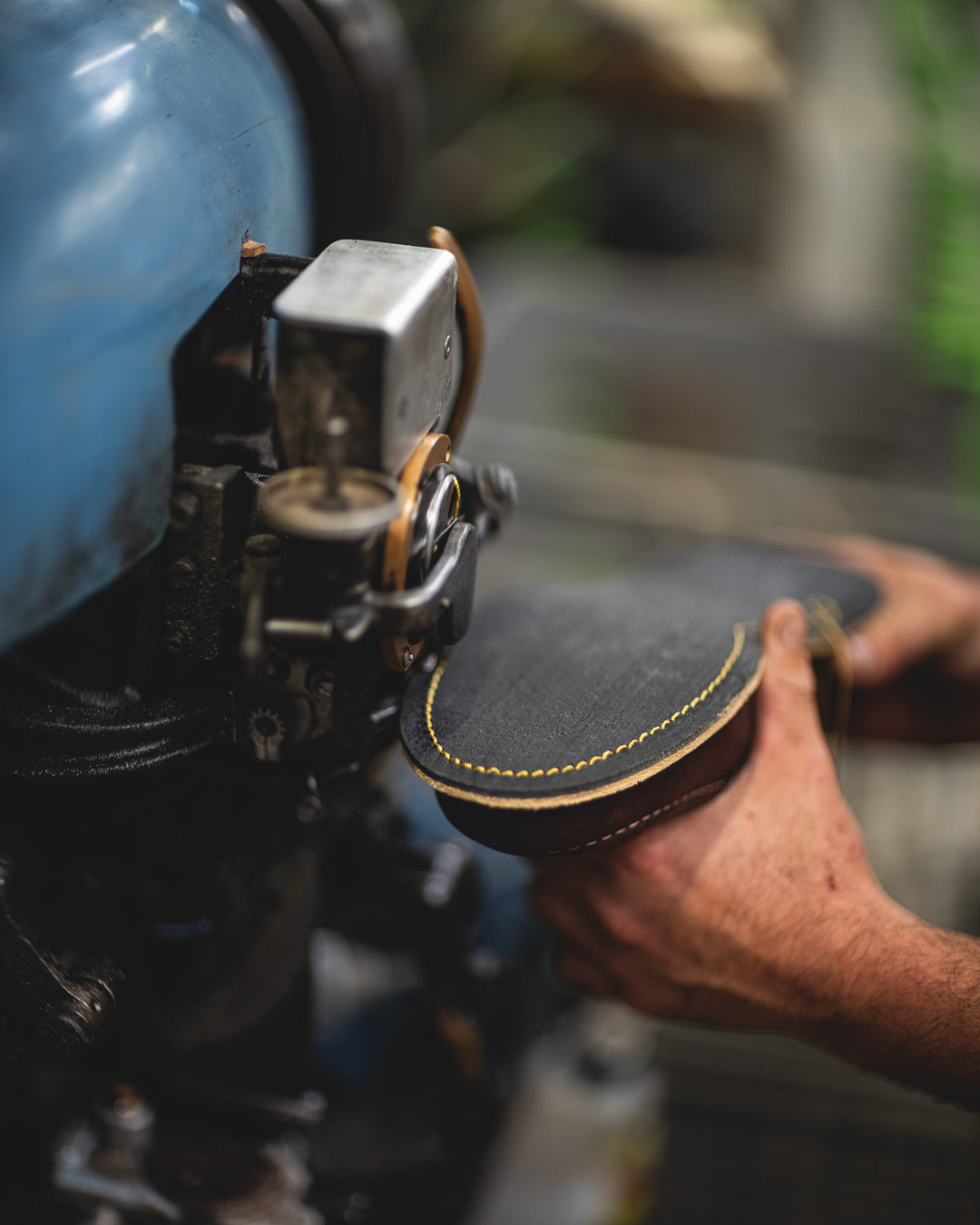 burgundy rambler midsole being stitched