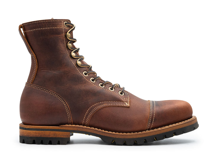 auburn brown leather boot on a white background side view