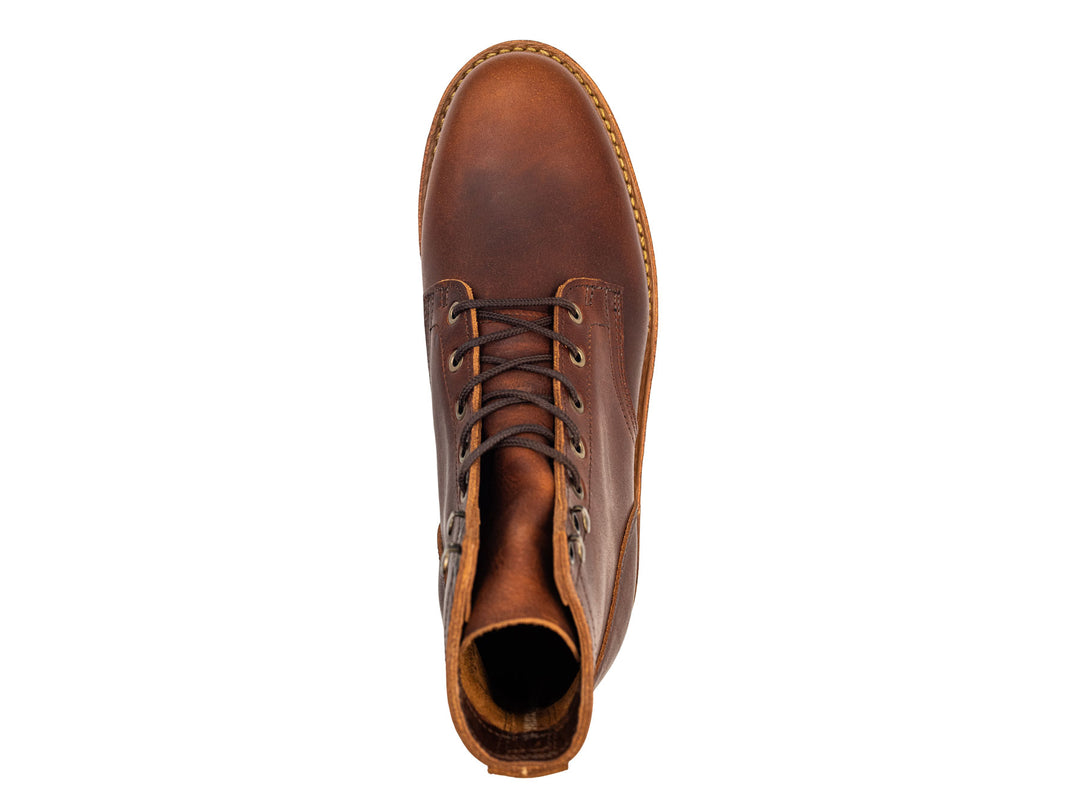 auburn brown leather boot on a white background topdown view
