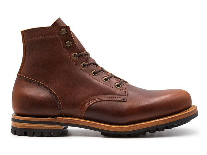 auburn brown leather boot on a white background side view