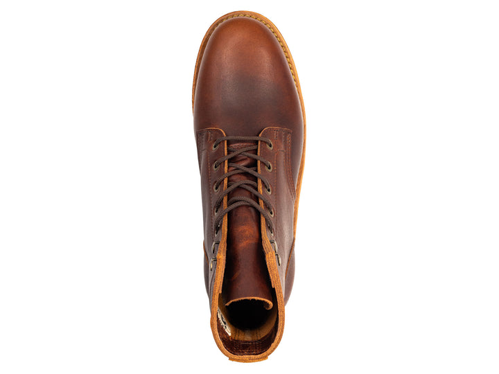 auburn brown leather boot on a white background topdown view