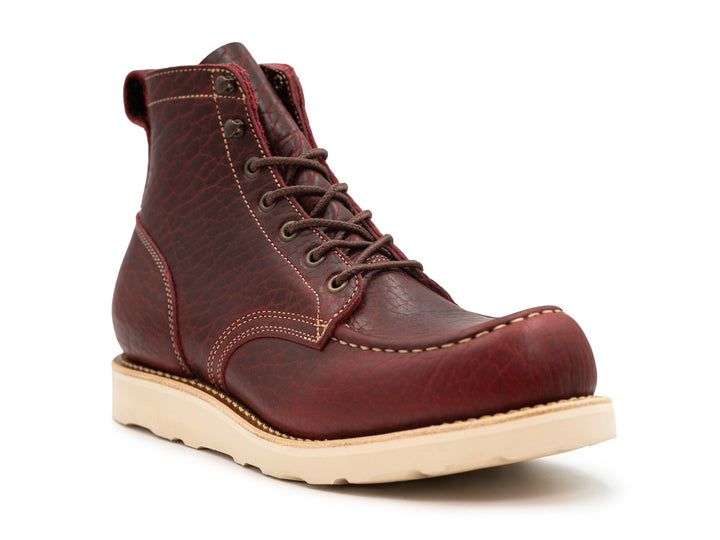 three-quarter view black cherry shrunken bison boot on wedge sole on white background