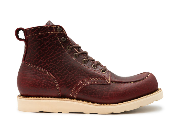 side view black cherry shrunken bison boot on wedge sole on white background