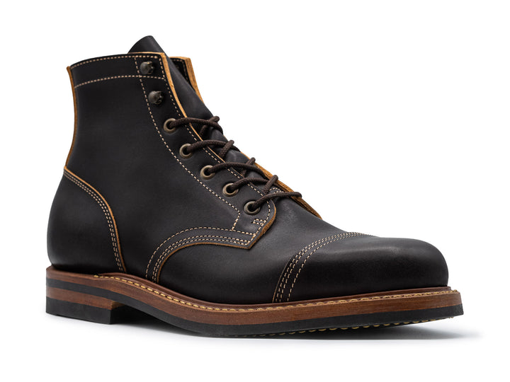 3QTR view of black leather boot on white background