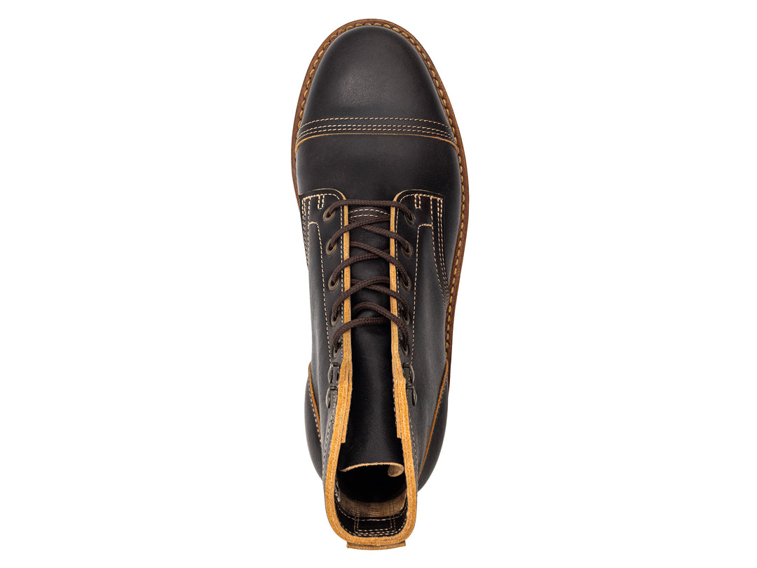 topdown view of black leather boot on white background