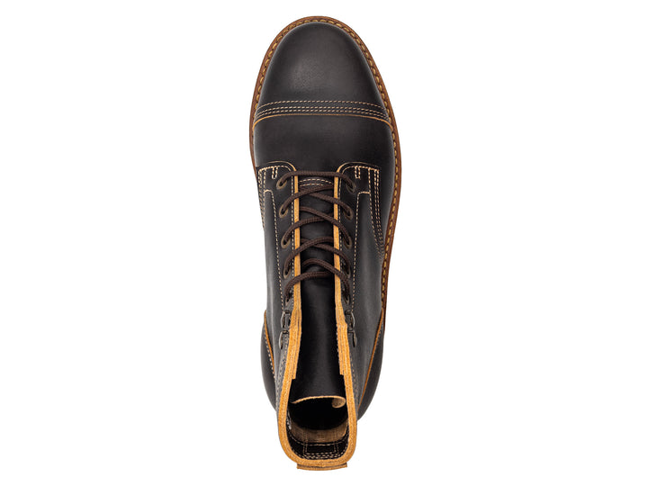 topdown view of black leather boot on white background