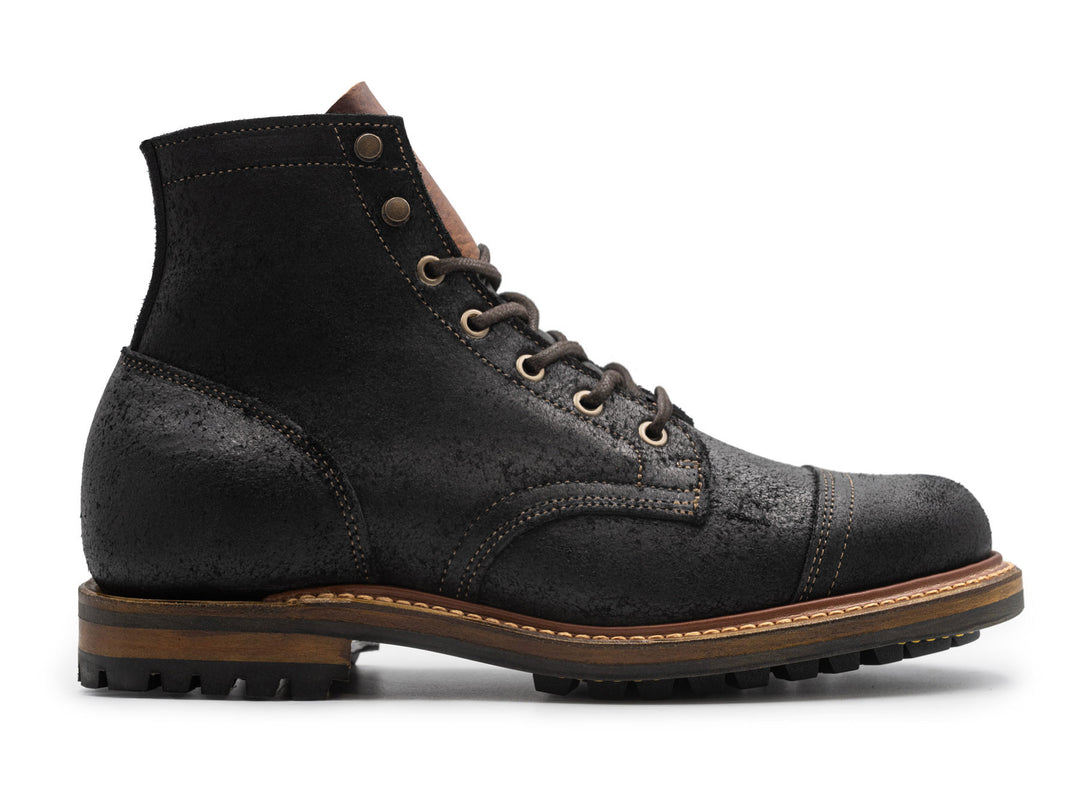 black rough out leather boot on white background