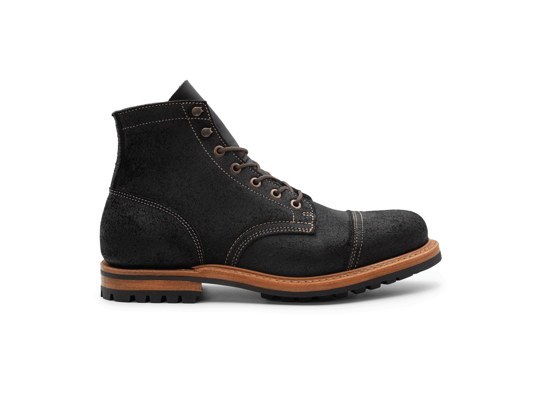 black leather boot on a white background rotating 360° view
