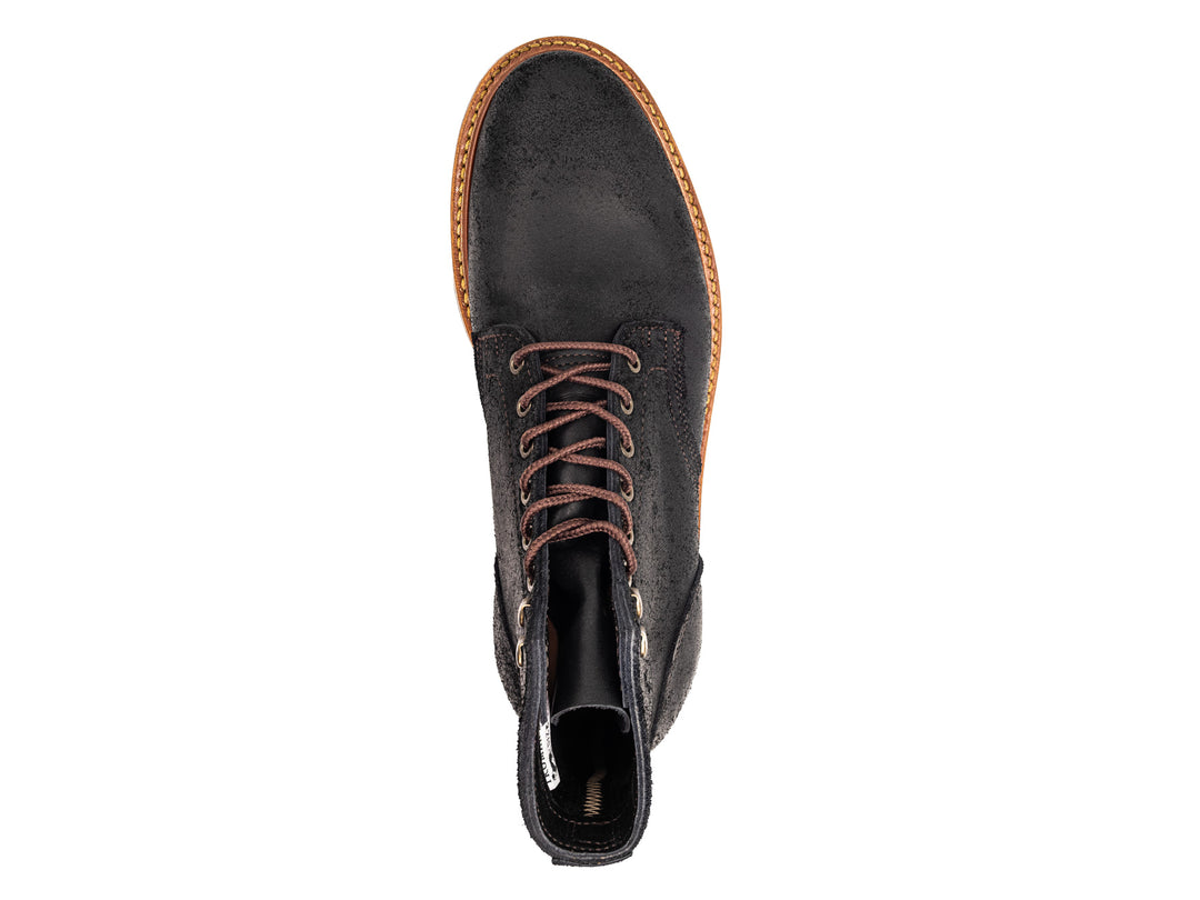 topdown view of black rough out boot on white background