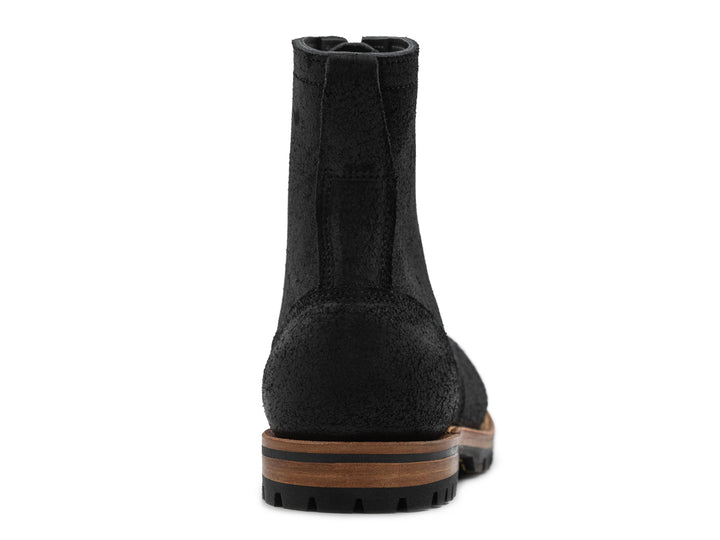 black rough out leather boot on a white background front view