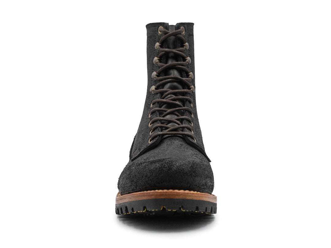 black rough out leather boot on a white background front view