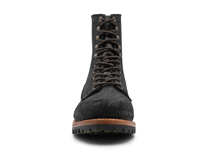 black rough out leather boot on a white background front view