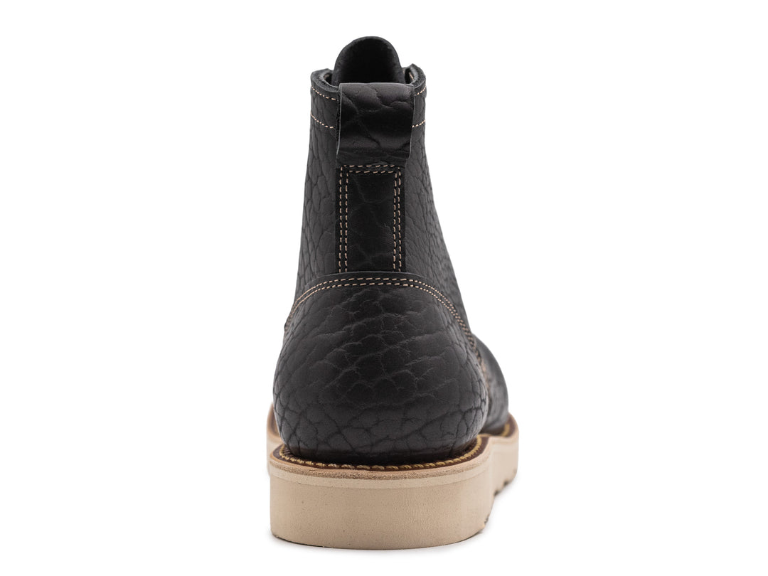 rear view black shrunken bison boot on wedge sole on white background
