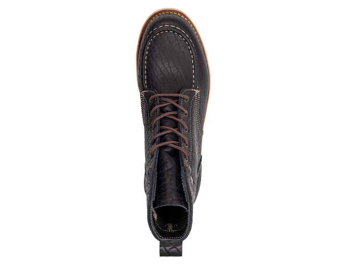 topdown view black shrunken bison boot on wedge sole on white background