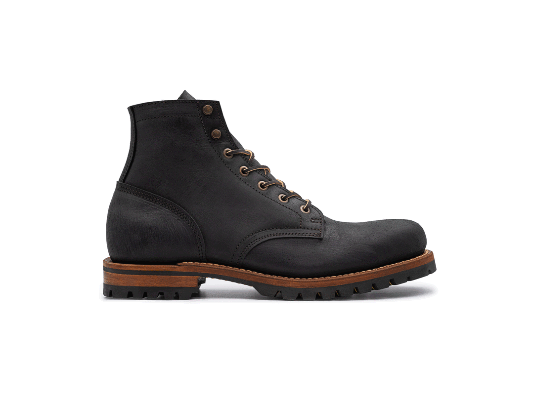 black leather boot on a white background rotating 360° view