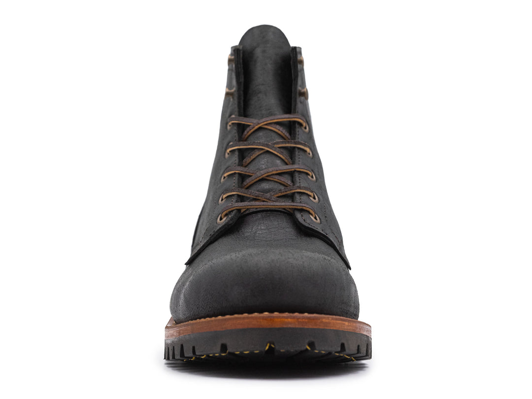 black leather boot on a white background front view