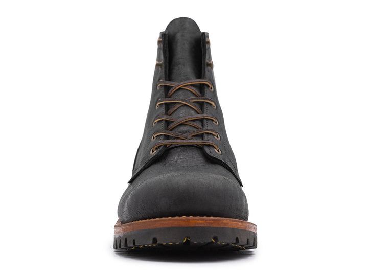 black leather boot on a white background front view