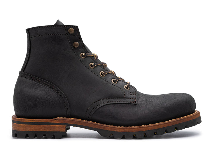 black leather boot on a white background side view