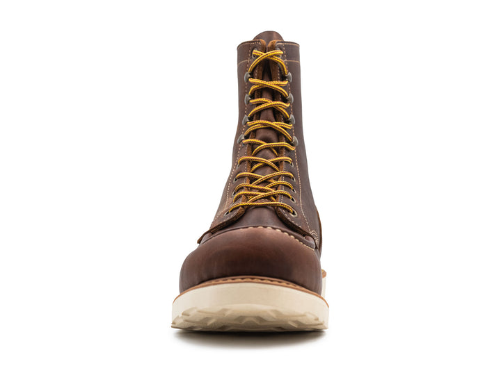 brown leather moc toe boot on a white background front view
