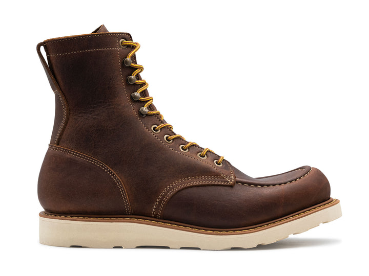 brown leather moc toe boot on a white background side view