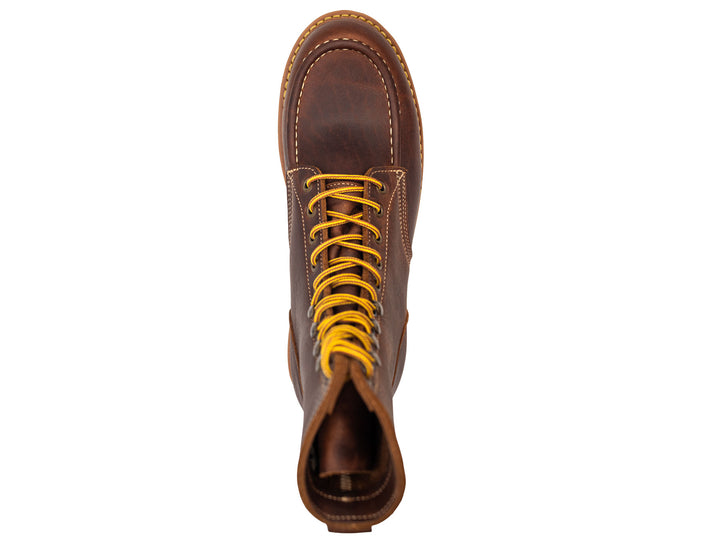 brown leather moc toe boot on a white background topdown view