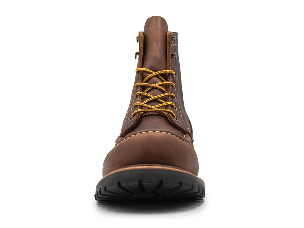 brown leather moc toe boot on a white background front view