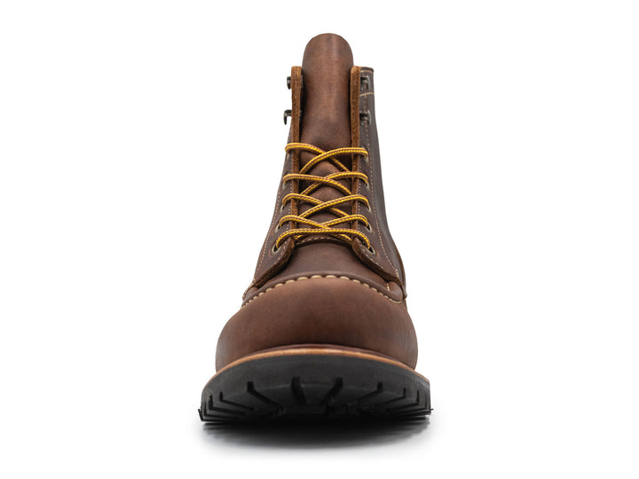brown leather moc toe boot on a white background front view