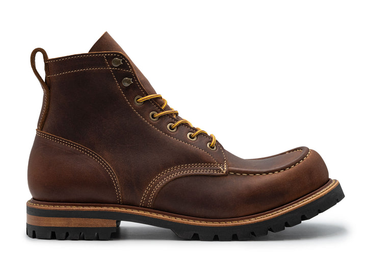 brown leather moc toe boot on a white background side view