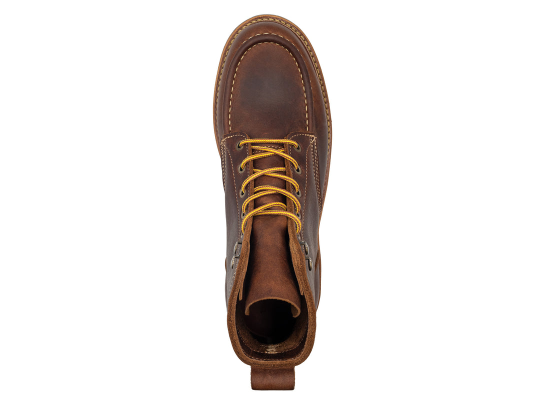 brown leather moc toe boot on a white background topdown view