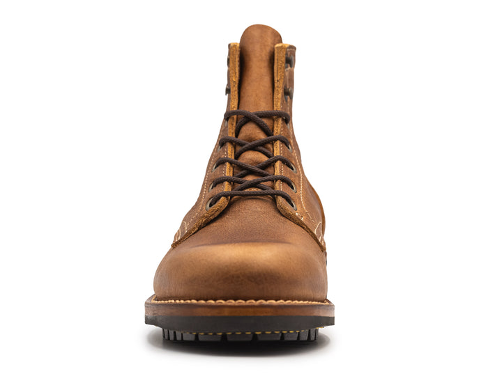 tan leather boot on a white background front view