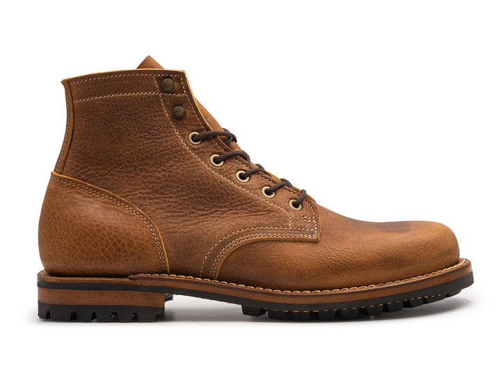 tan leather boot on a white background side view