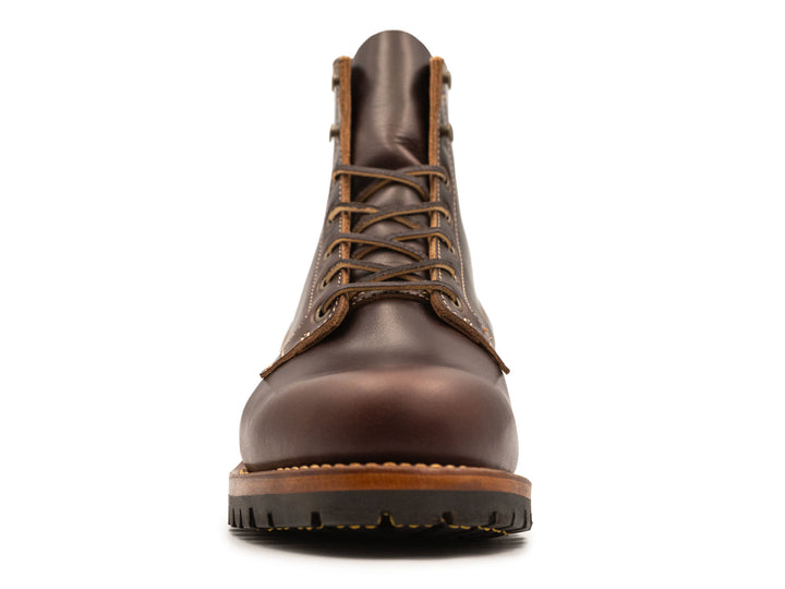 dark brown leather boot on a white background front view