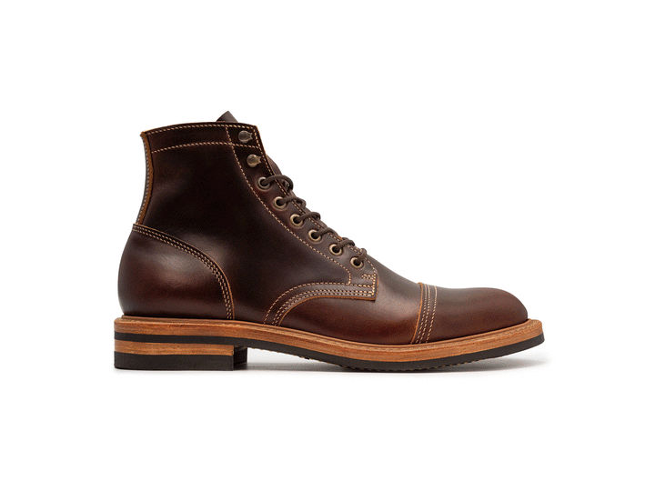 brown leather boot rotating on white background 