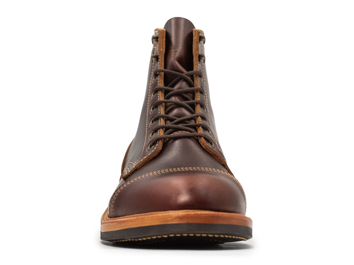 brown leather boot on white background front view