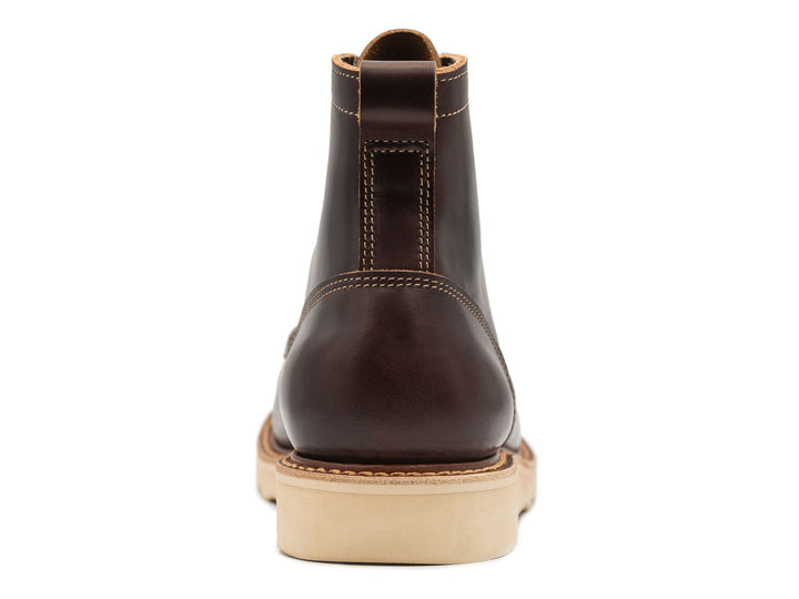 dark brown leather boot on a white background view from behind