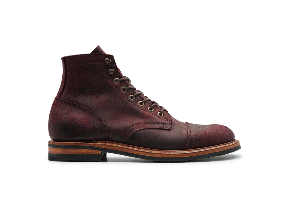 rotating 360° view of dark burgundy leather boot on white background