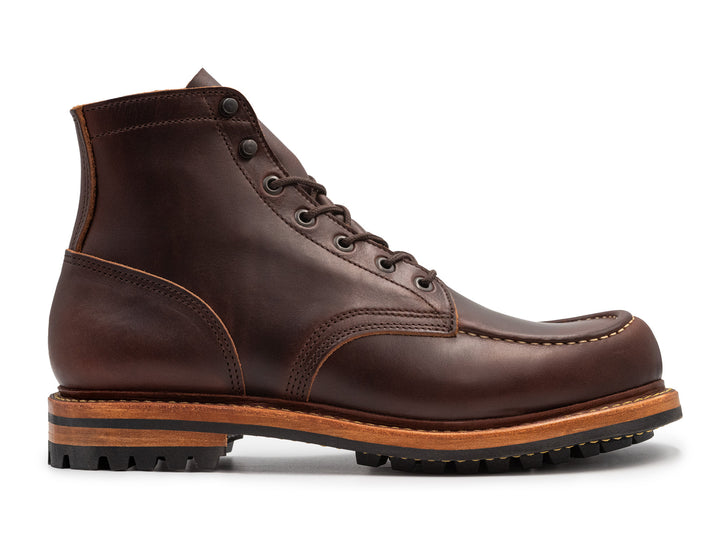 side view of brown smooth leather boot on white background