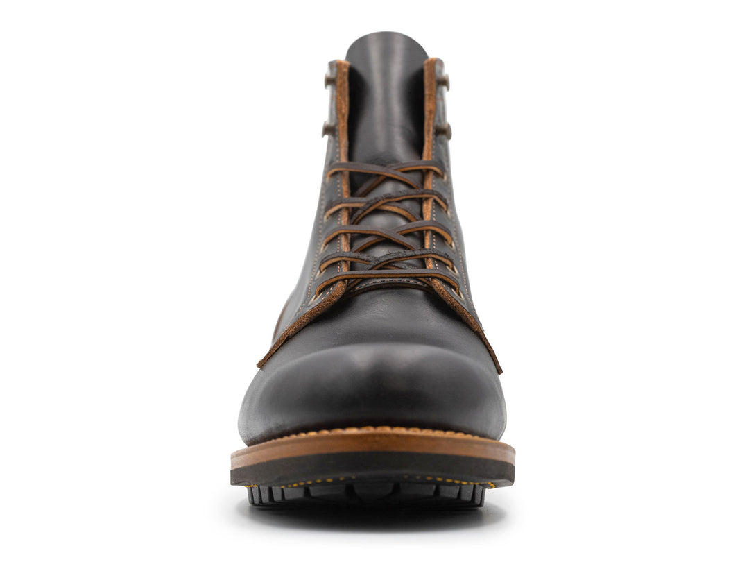 black leather boot on a white background front view