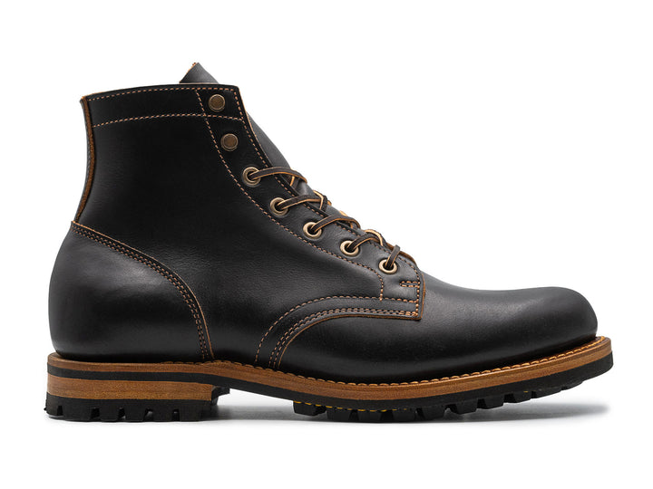 black leather boot on a white background side view