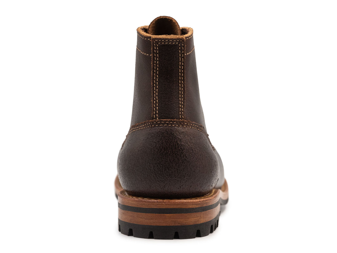 dark brown leather boot on a white background view from here