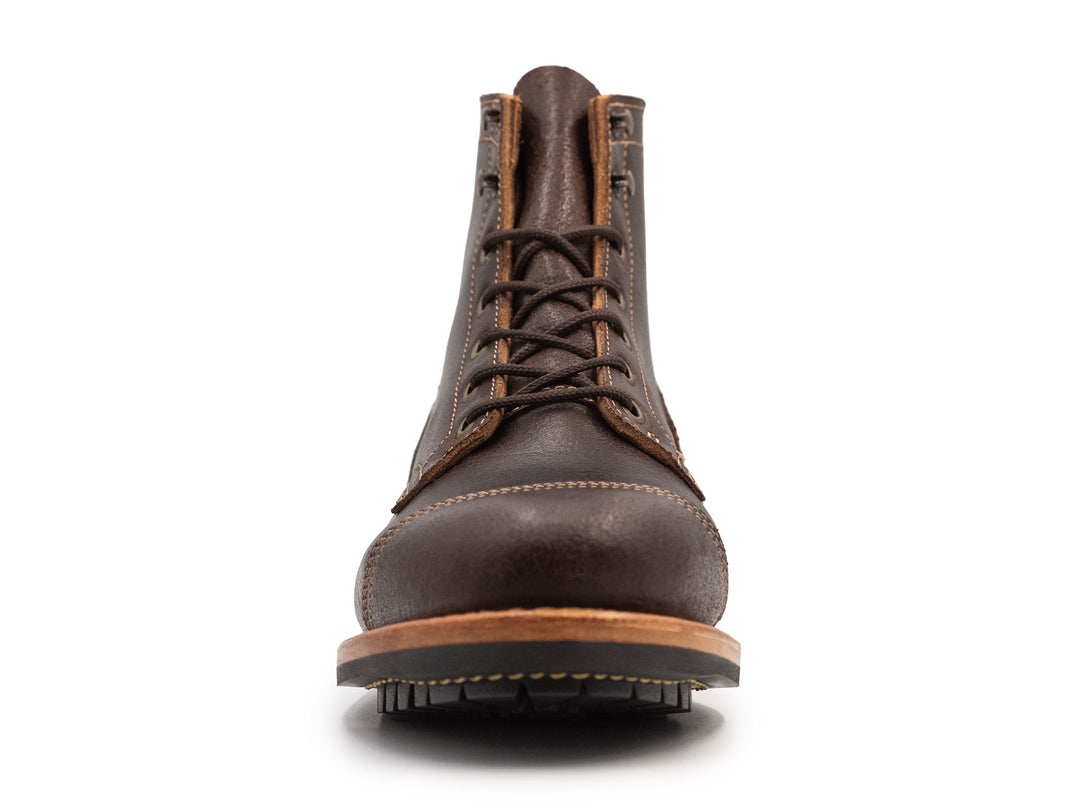 dark brown leather boot on a white background front view