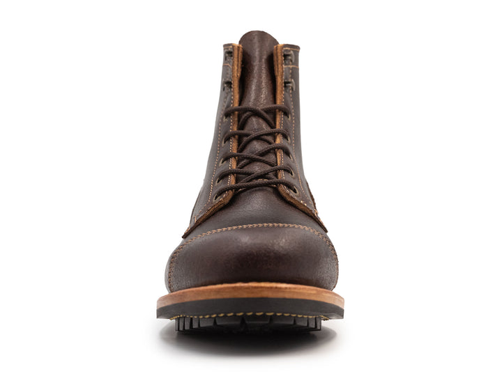 dark brown leather boot on a white background front view