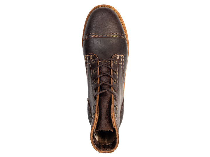 dark brown leather boot on a white background topdown view