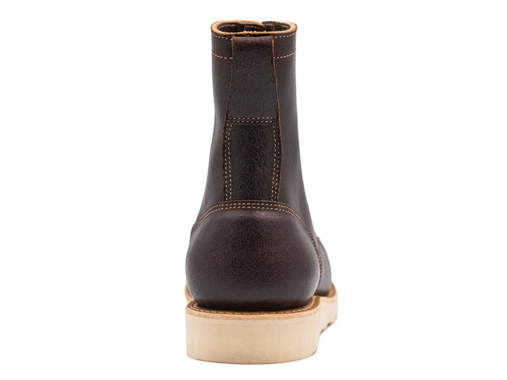 dark brown leather moc toe boot on a white background view from behind