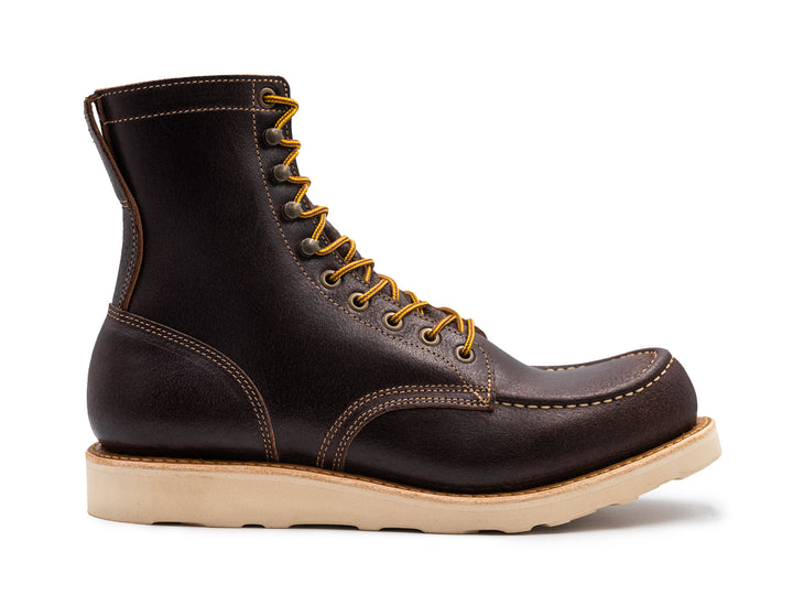 dark brown leather moc toe boot on a white background side view