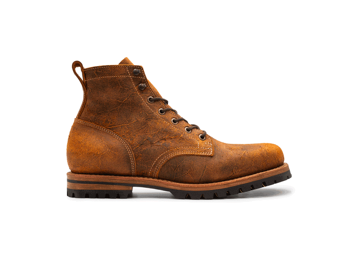 rotating 360° view of brown orange textured leather boot on white background