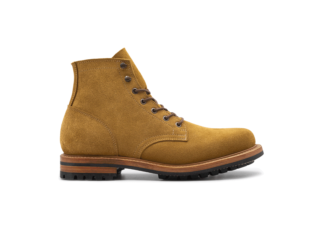 tan leather boot on a white background rotating 360° view