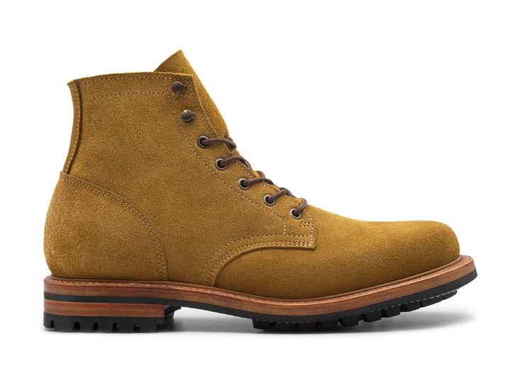 tan leather boot on a white background side view