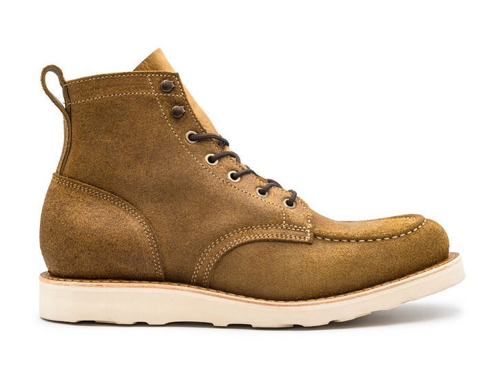 tan rough out leather moc toe boot on a white background side view